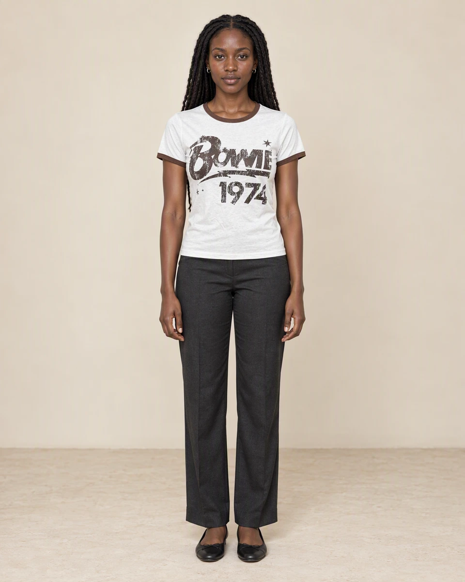 Achieng wearing a white Bowie 1974 tee with brown trim in The Evening Edit campaign.