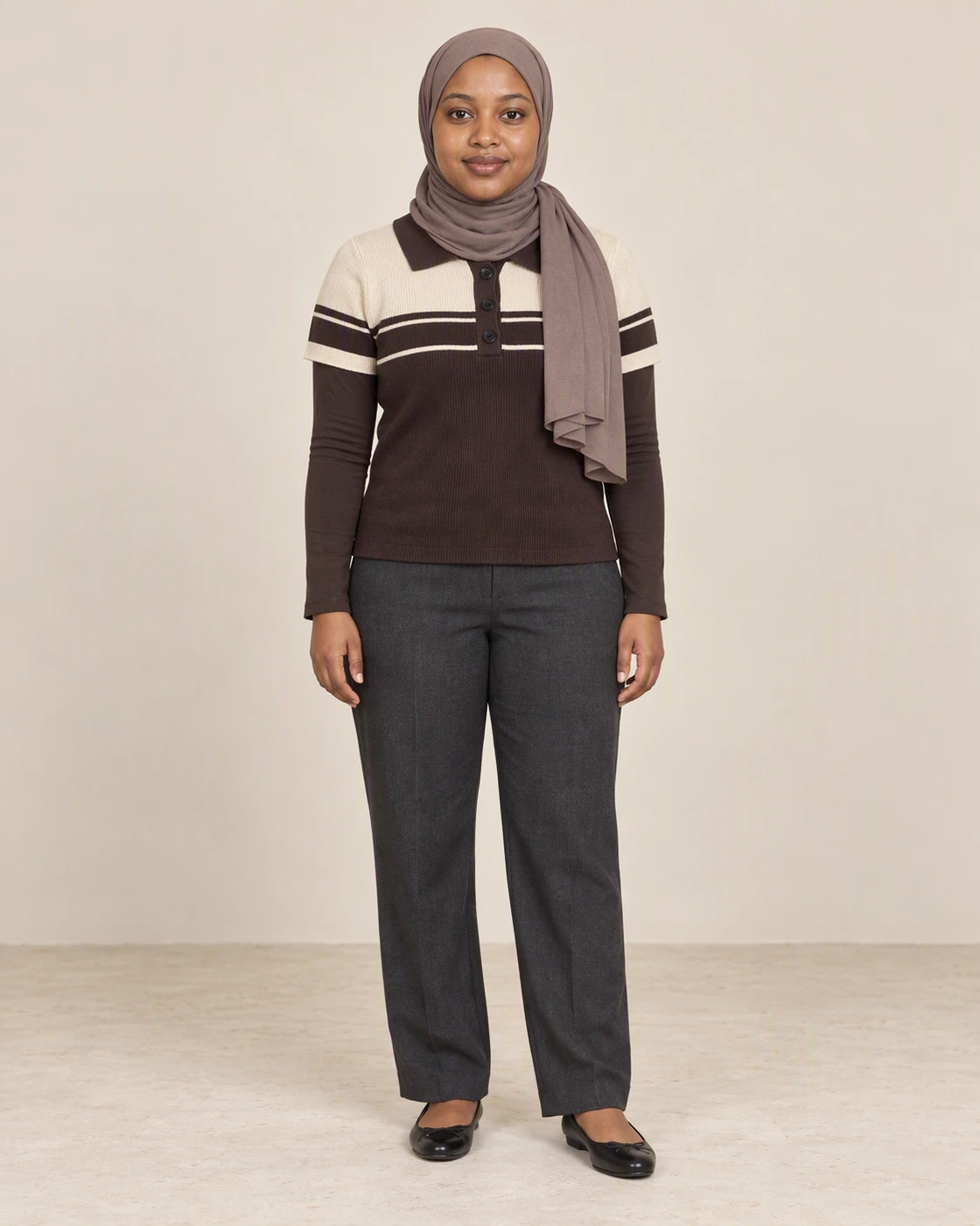 Halima wearing a cream and chocolate striped polo in The Evening Edit campaign.