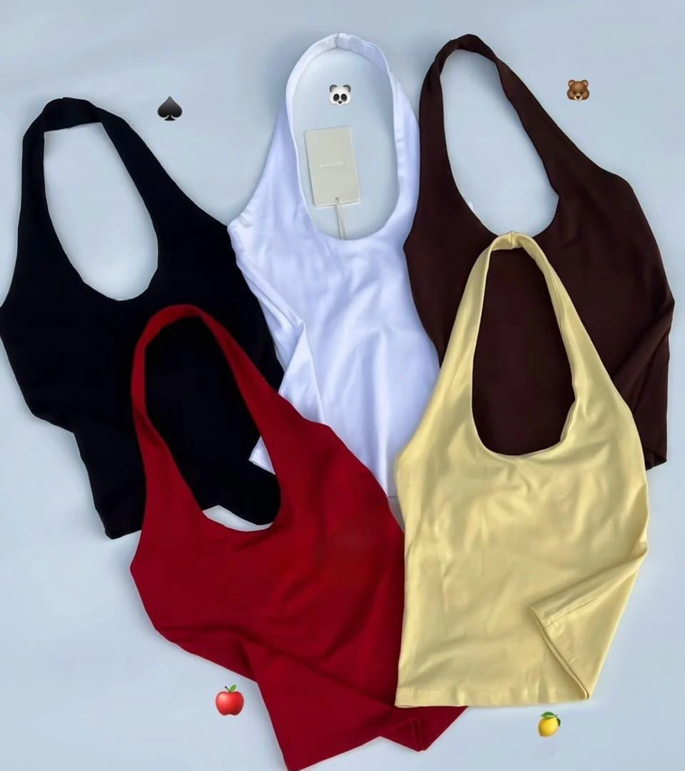 Overlapping black, white, brown, red and pale-yellow scoop-neck halter tops in the supplied flatlay photograph.
